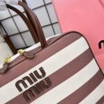 ⁦حقيبة ميوميو القماشية المخططة⁩ - الصورة ⁦9⁩