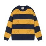 سترة غوتشي الصوفية المحبوكة ذات الياقة المستديرة، مخططة باللونين البرتقالي والأسود